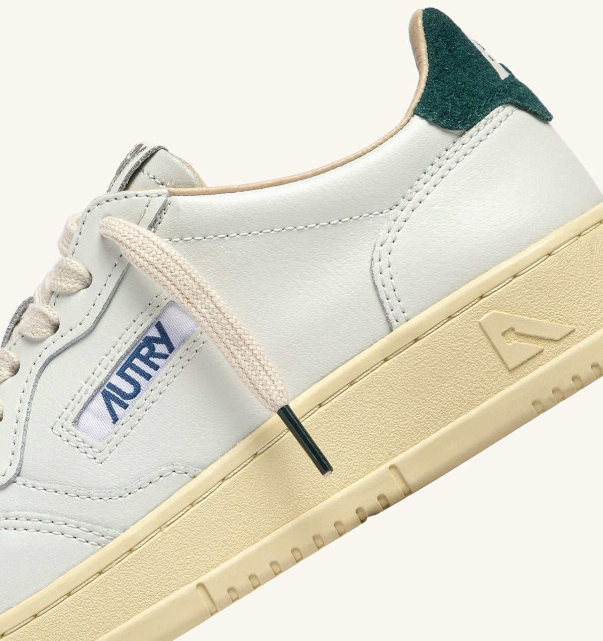 AUTRY Man MEDALIST LOW SNEAKERS IN WHITE LEATHER AND DARK SEA SUEDE