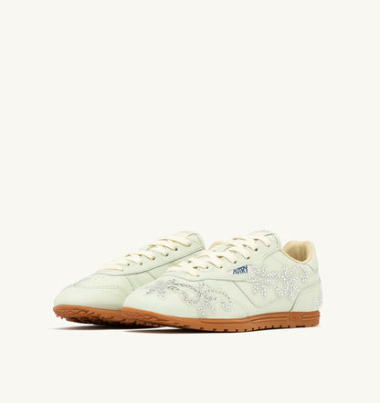 AUTRY Woman WINDSPIN SNEAKERS IN BONE WHITE LEATHER WITH DECORATIONS