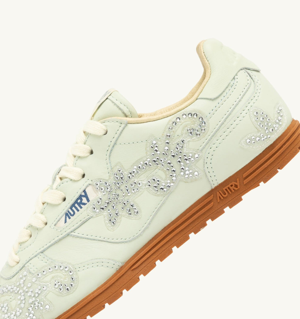 AUTRY Woman WINDSPIN SNEAKERS IN BONE WHITE LEATHER WITH DECORATIONS
