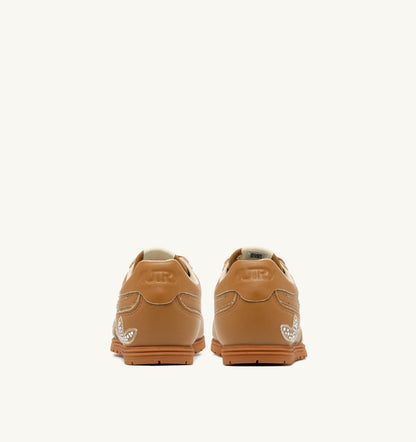 AUTRY Woman WINDSPIN SNEAKERS IN EARTH LEATHER WITH DECORATIONS