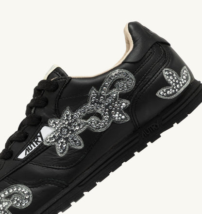 AUTRY Woman WINDSPIN SNEAKERS IN BLACK LEATHER WITH DECORATIONS