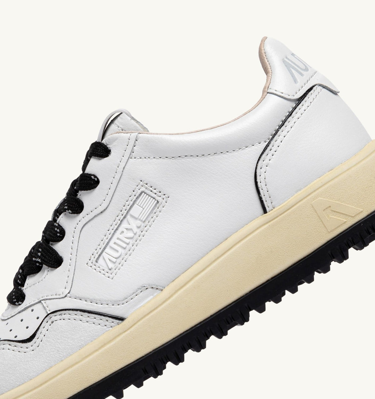 AUTRY Woman GOLF LOW SNEAKERS IN WHITE AND BLACK LEATHER