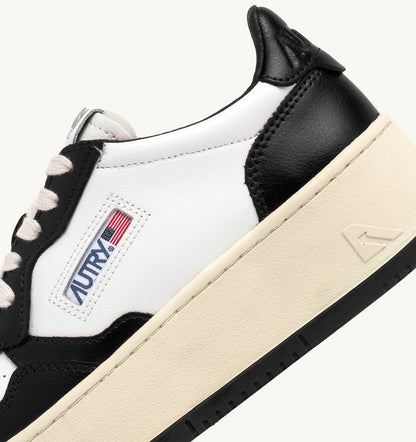 AUTRY Woman MEDALIST PLATFORM SNEAKERS IN WHITE AND BLACK LEATHER