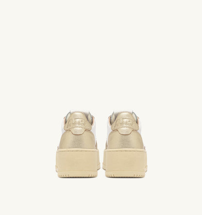 AUTRY Woman MEDALIST PLATFORM SNEAKERS IN WHITE AND METALIZED PLATINUM LEATHER
