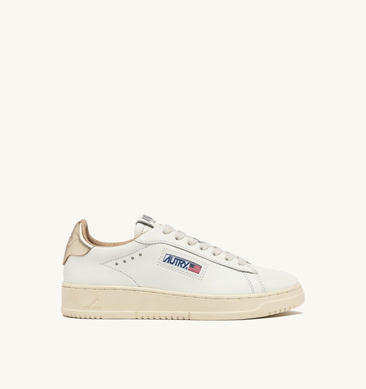 AUTRY Woman DALLAS LOW SNEAKERS IN WHITE AND GOLD LEATHER