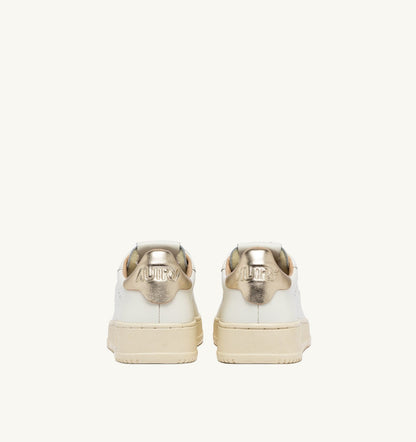 AUTRY Woman DALLAS LOW SNEAKERS IN WHITE AND GOLD LEATHER